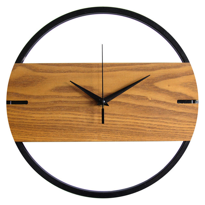 Wooden wall clock with black metal frame on a white background