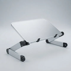 Silver aluminum laptop stand with black rubber feet and adjustable joints, shown on a light gray studio background.