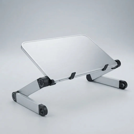 Silver aluminum laptop stand with black rubber feet and adjustable joints, shown on a light gray studio background.