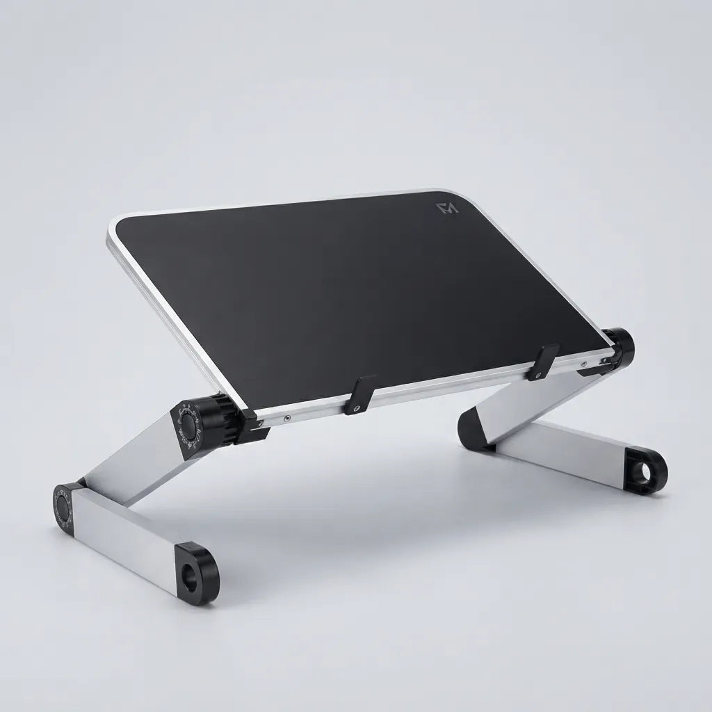 A silver aluminum laptop stand with a black top surface, shown at an angle on a light gray studio background.