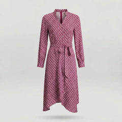 A long-sleeve wrap dress with a geometric pattern in pink and dark red, featuring a tie belt at the waist and a split neckline, shown against a light gray background.