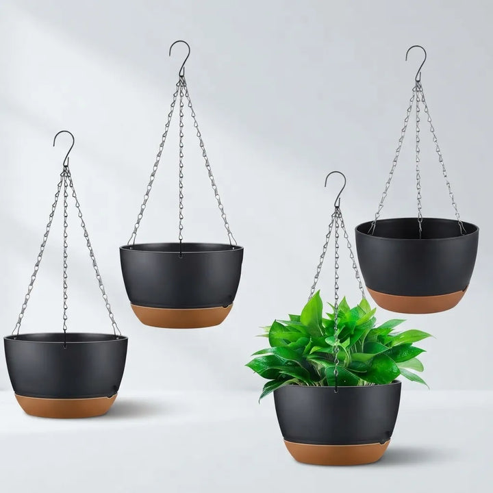 Three black hanging planters with terracotta-colored bases are shown against a light gray background, with one planter in the foreground holding a green leafy plant.