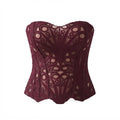 A burgundy lace corset bustier with an intricate floral lace pattern and sheer mesh details, shown against a plain white background.