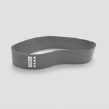A dark gray silicone headband with a white vertical label that reads 'X-DENY' and features four small white heart icons, shown on a light gray background.