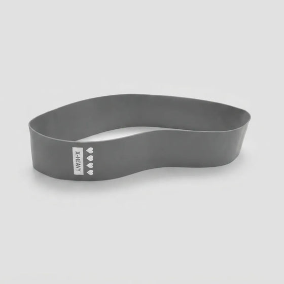 A dark gray silicone headband with a white vertical label that reads 'X-DENY' and features four small white heart icons, shown on a light gray background.