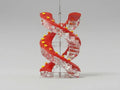A spiral-shaped hanging ornament or decorative sculpture made of translucent clear acrylic with bold red twisted bands and small yellow star accents, shown against a plain light gray studio background.