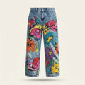 Light blue denim jeans with a vibrant, multicolored floral print, shown against a plain light beige background.