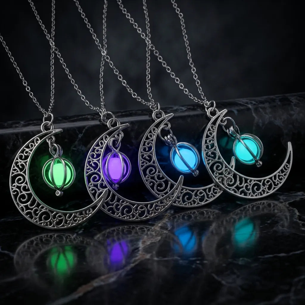Four silver crescent moon necklaces with glowing light-up bead pendants in green, purple, blue, and teal, displayed on a dark reflective surface.