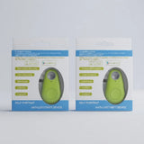 Two retail boxes of a self-portrait anti-lost-theft device shown side by side on a light gray background. Each package contains a small oval-shaped lime green device visible through a clear window, with blue and white packaging and printed product details.