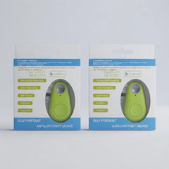 Two retail boxes of a self-portrait anti-lost-theft device shown side by side on a light gray background. Each package contains a small oval-shaped lime green device visible through a clear window, with blue and white packaging and printed product details.