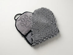 A gray pet microfiber washcloth with a textured chenille side and a soft fabric side featuring an embroidered paw print, displayed on a clean white background.
