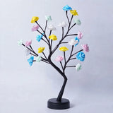 Decorative tree with colorful flowers on a white background
