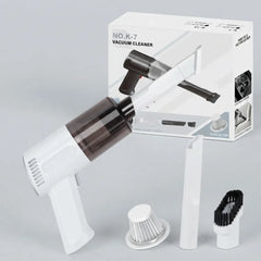White handheld vacuum cleaner with a dark transparent dust bin, shown with its retail box and three accessories on a light gray background.