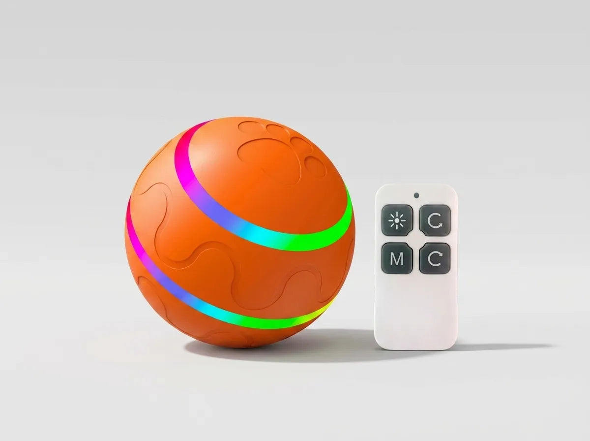An orange textured spherical light-up toy with glowing multicolor LED rings, shown next to a small white remote control on a light gray background.