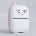 A compact, cute cat-shaped portable device, likely a power bank or mini printer, featuring a white body with a pink side panel, pink ears, and a winking cartoon face on the front.