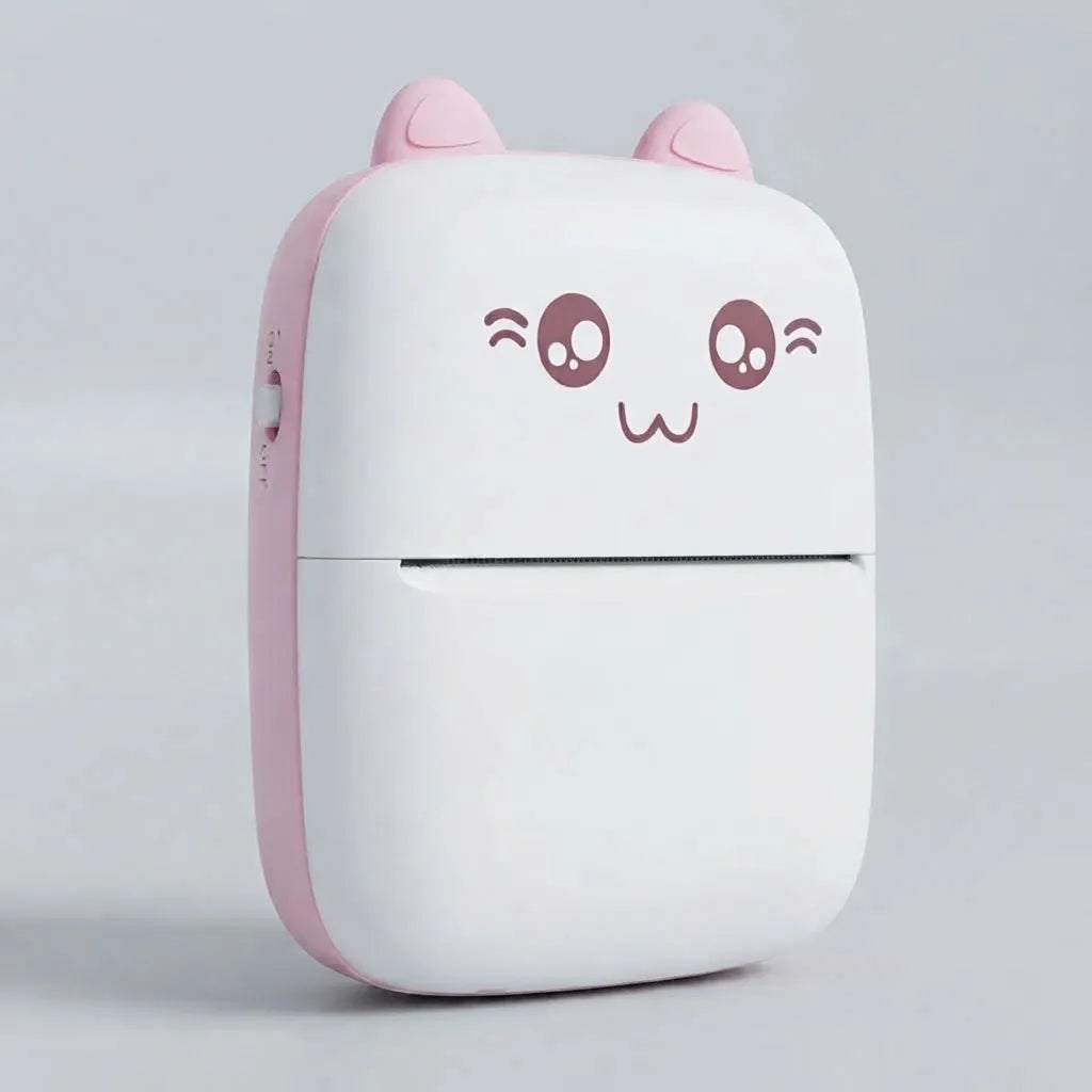 A compact, cute cat-shaped portable device, likely a power bank or mini printer, featuring a white body with a pink side panel, pink ears, and a winking cartoon face on the front.