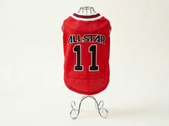 A red mesh pet jersey displayed on a small metal stand against a plain light background. The jersey has a white and red collar and features the text 'ALL-STAR' and the number '11' in black with white outlines on the back.