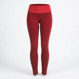 Red high-waisted leggings with a textured honeycomb pattern, shown on a white studio background.
