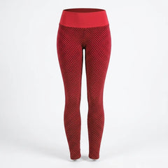 Red high-waisted leggings with a textured honeycomb pattern, shown on a white studio background.