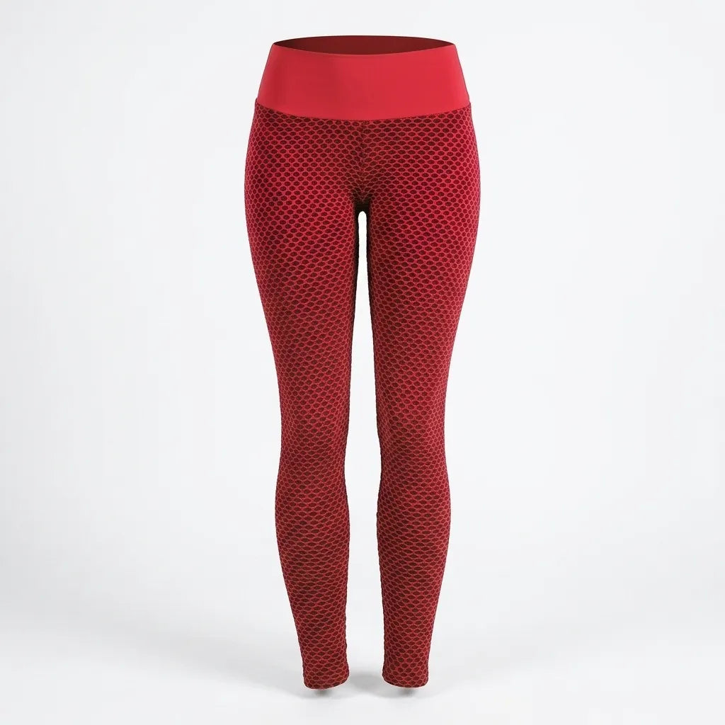 Red high-waisted leggings with a textured honeycomb pattern, shown on a white studio background.