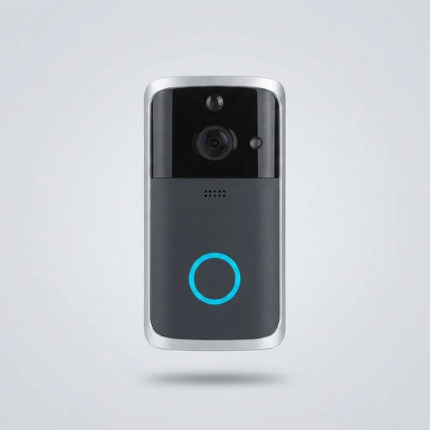 A modern smart video doorbell with a black and dark gray face, silver metallic edges, a central camera lens, and a glowing blue circular indicator light, shown floating against a light gray background.