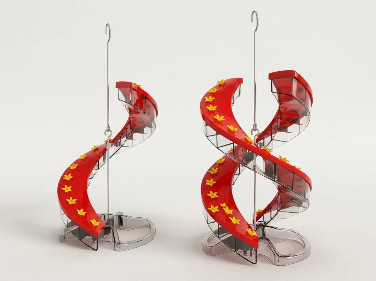 Two miniature spiral staircase ornaments in red with yellow star accents and clear plastic supports, shown on a plain light background.