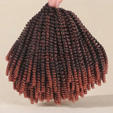A hand holds up a large bundle of coiled twist braids with a dark brown to coppery reddish-brown ombré color gradient, set against a plain beige background.