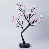 Decorative tree with pink and white flowers on a light gray background