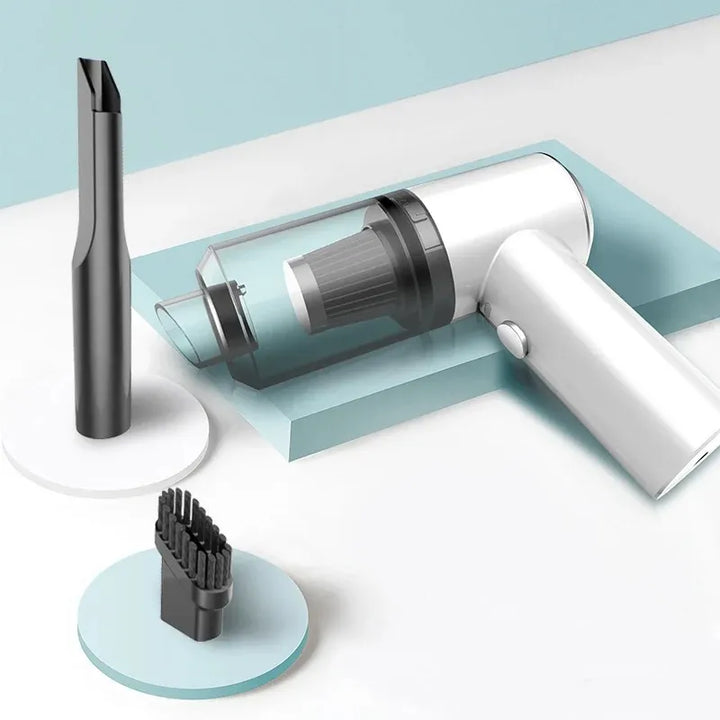 White handheld vacuum cleaner with attachments on a light blue and white background