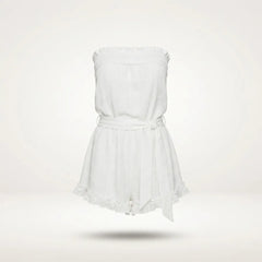 A white strapless romper with a ruffled neckline, a matching fabric tie belt at the waist, and a ruffled hem, shown floating against a light off-white background.