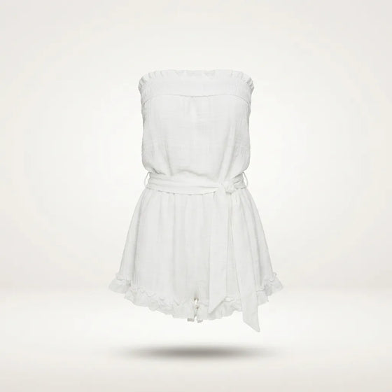 A white strapless romper with a ruffled neckline, a matching fabric tie belt at the waist, and a ruffled hem, shown floating against a light off-white background.